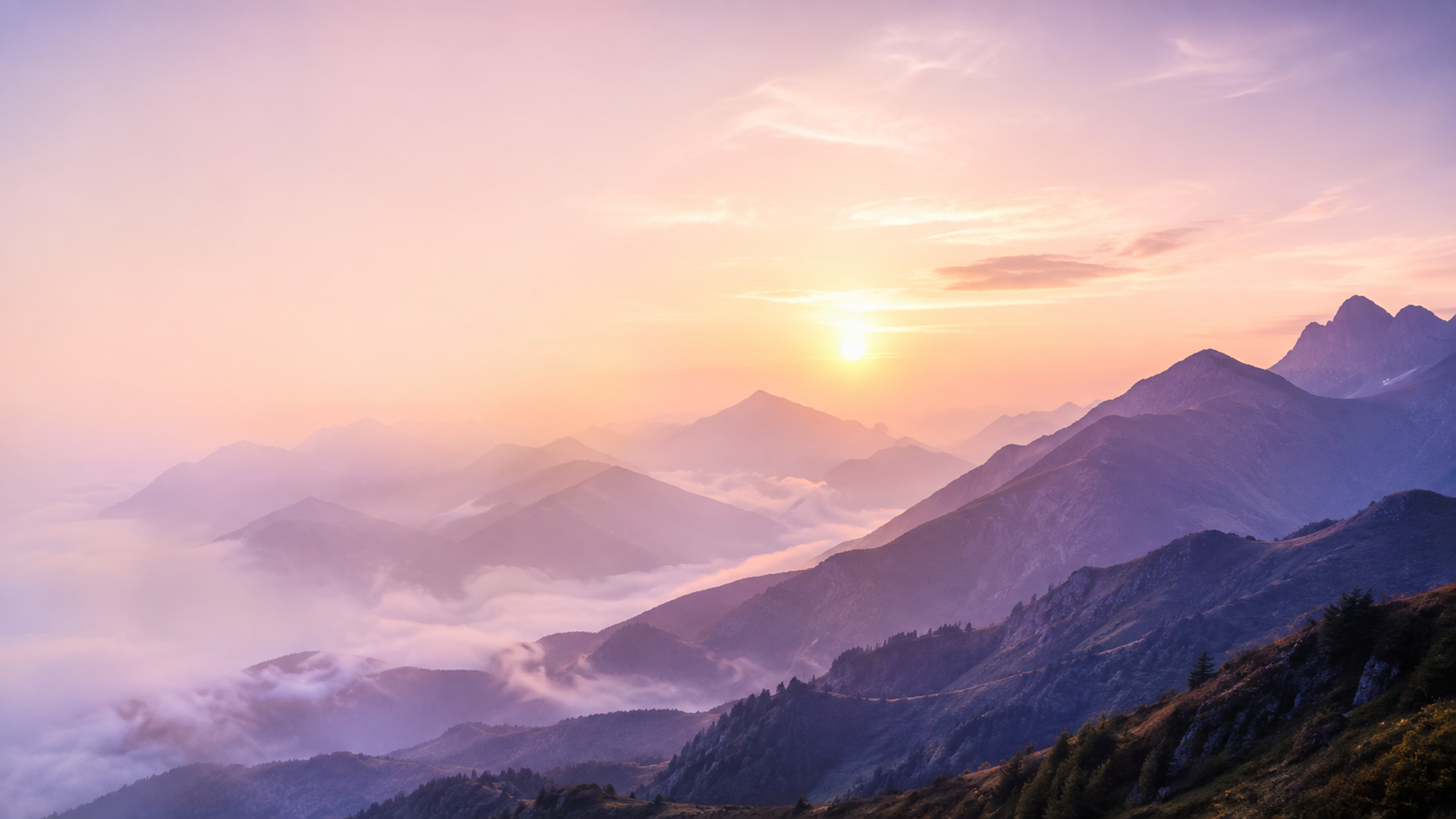 Sunrise over misty mountains